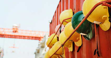 Hardhats on a shipping container